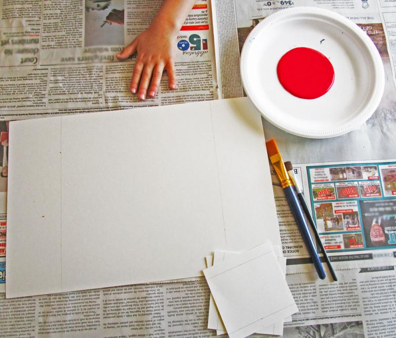 Gather your supplies to make handprint Canada flags. 