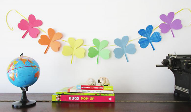 Making a shamrock garland using rainbow paper is a terrific St. Patrick's Day activity for kids. 