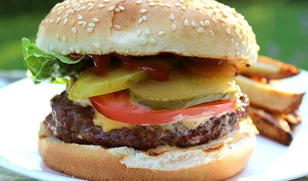 My family loves biting into the burger and tasting the herbed cream cheese in the middle. You can make a big batch of these burgers in advance if you like; they freeze really well. | YMC