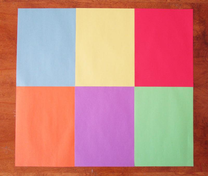 Arrange six sheets of construction paper together.